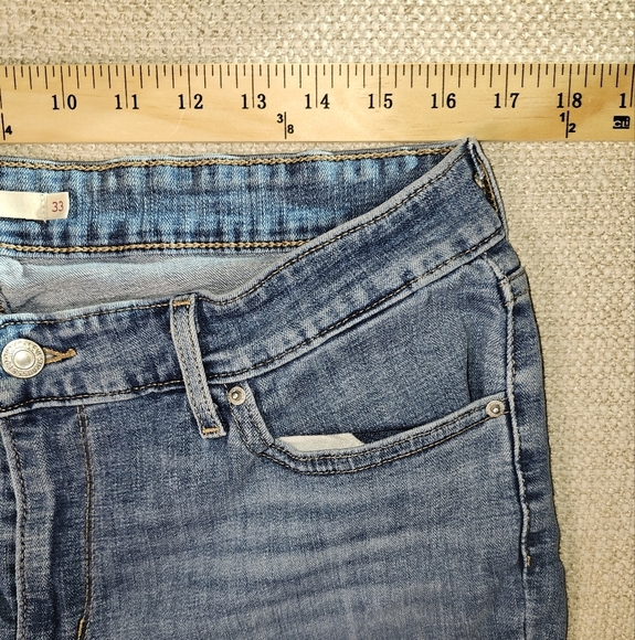 Levis Women's 711 Skinny Jean, Medium Wash, Mid Rise, Freyed Hem Size 33 - Picture 6 of 13